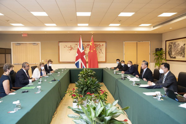 Wang yi meets with british secretary of state for foreign and commonwealth affairs james cleverly